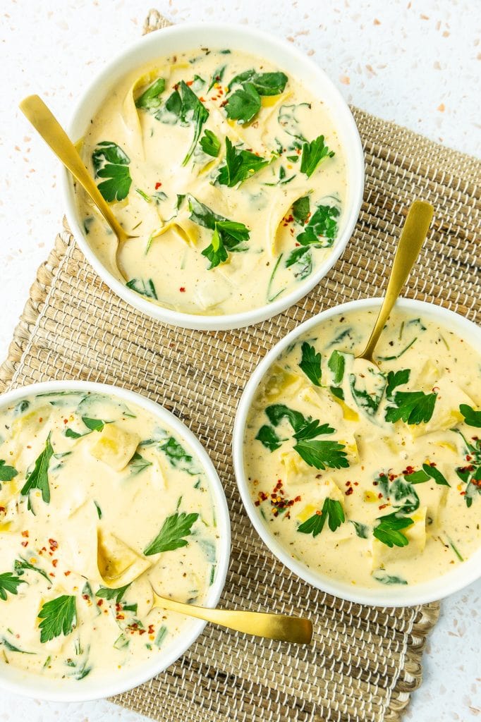 Bowls of lasagna soup with spoons