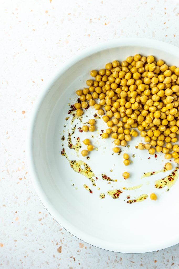 Chickpeas and oil in pan