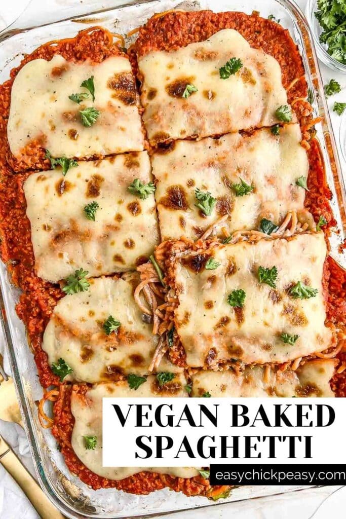 vegan baked spaghetti with a slice being removed, labeled for pinterest.