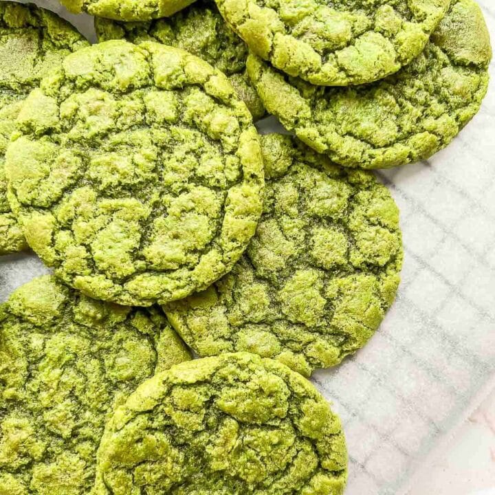 Matcha cookies stacked on top of each other.