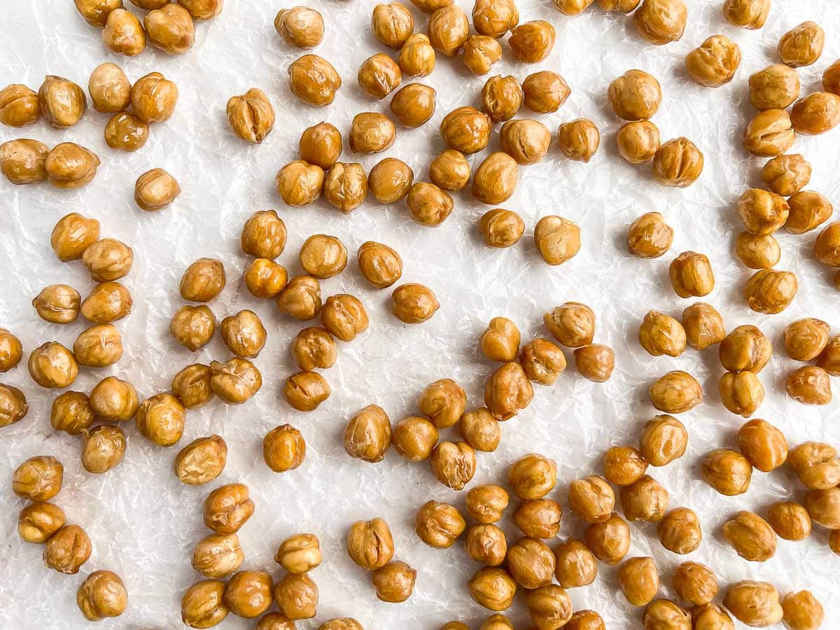 Roasted chickpeas on parchment paper.