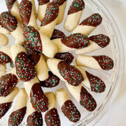 Shortbread cookies arranged on a glass plate.
