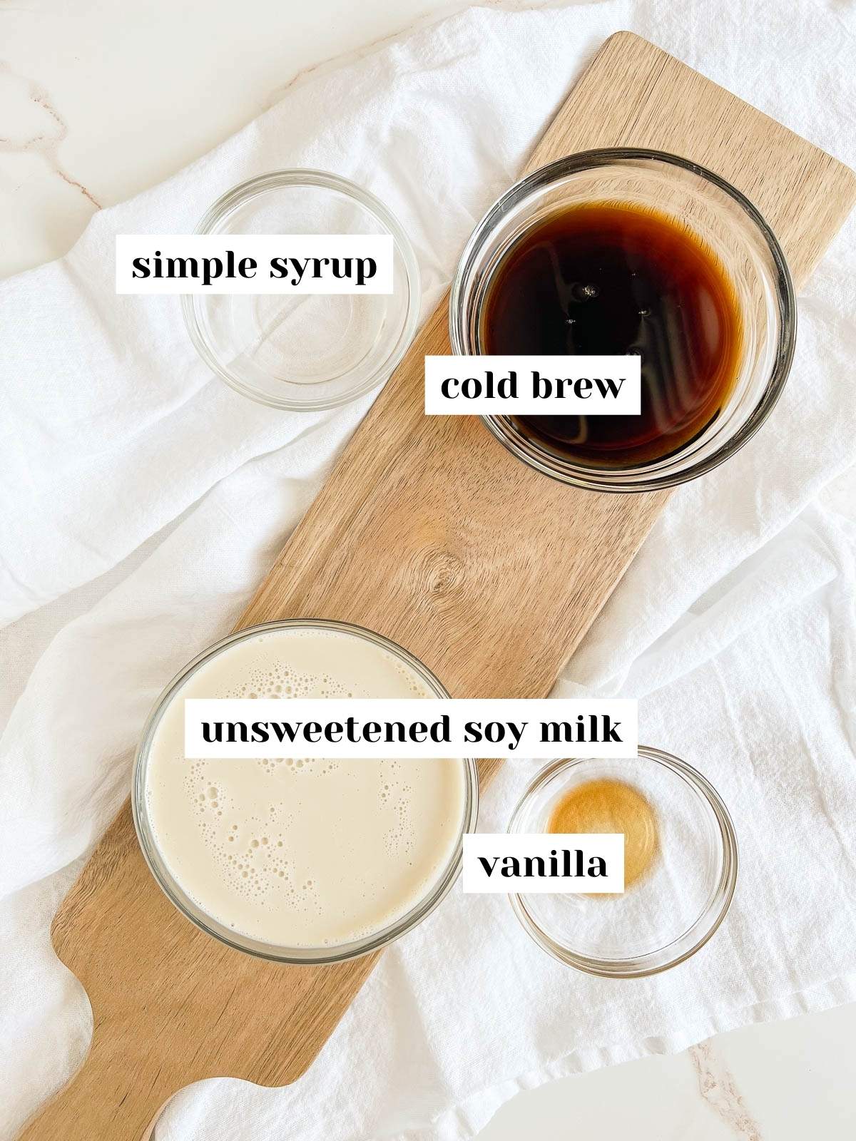 labeled ingredients for an iced cold brew latte.