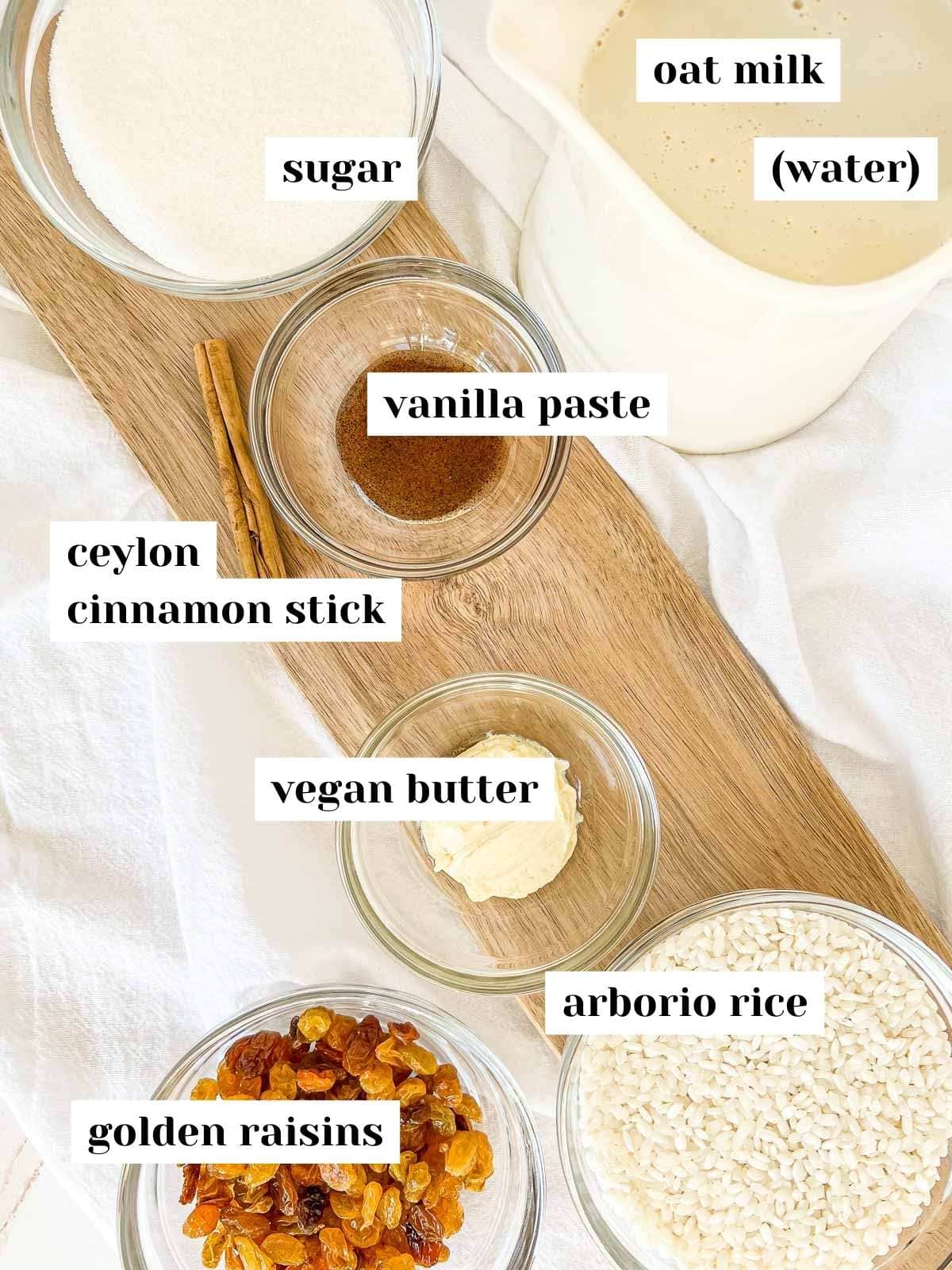 Labeled rice pudding ingredients on a serving board.